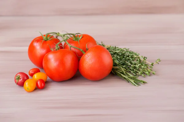 Collection tomato on a wooden background. — Stock Photo, Image