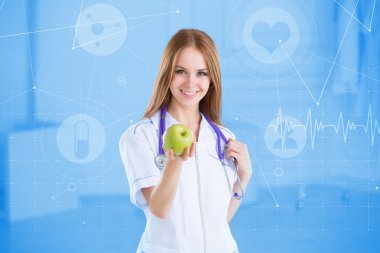 Tıbbi kavramı. Doktor elinde bir yeşil elma ile.