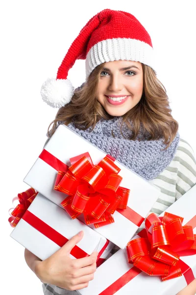 Santa kalapját karácsony nő tartja karácsonyi ajándékok mosolyog, boldog és izgatott. — Stock Fotó
