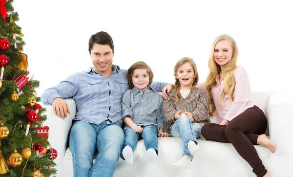 Happy family near the Christmas tree. — Stock Photo, Image