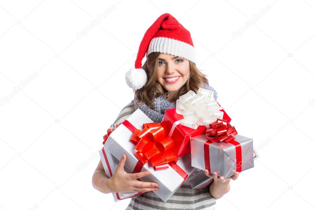 Smiling woman in santa helper hat with many gift boxes.