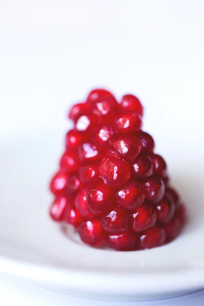 Extremo primer plano fondo de una fruta de granada madura jugosa roja semillas . —  Fotos de Stock