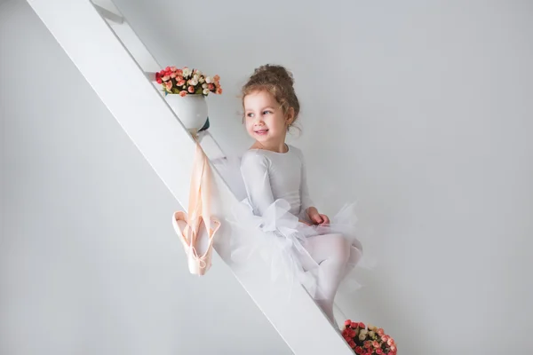 Little adorable young ballerina in a playful mood. — Stock Photo, Image