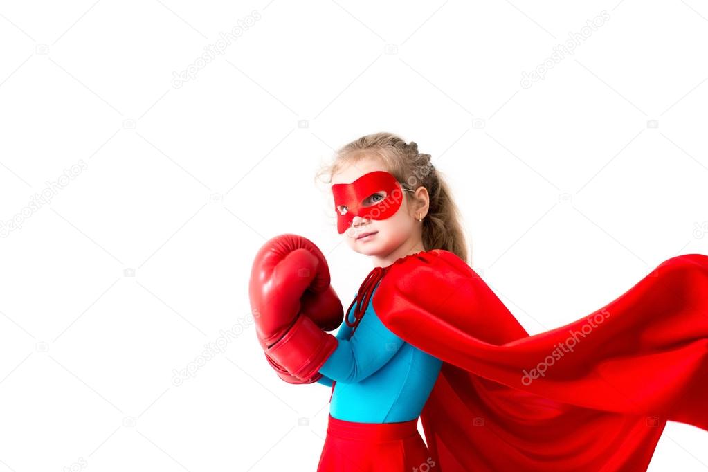 Superhero kid wearing boxing gloves Isolated on white background. 