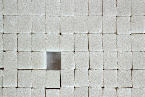 White cube shape sugars background,top view