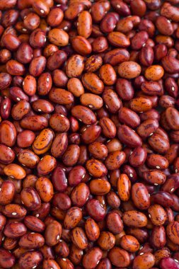 Close-up taken of red spotted pinto beans detailed food background