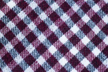 Mor, gri ve beyaz kareli boş yün arkaplan, üst görünüm