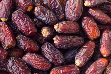 Büyük, lüks, kurutulmuş tatlı hurmalar arka plan olarak tasarlandı. Kavramsal gıda arka plan resmi.