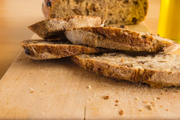 Slides of Handmade Bread on a Wood Table — Stock Photo, Image