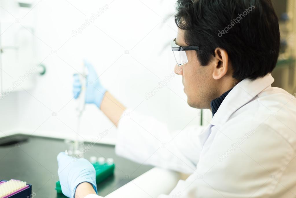 Researcher working with a Pipette