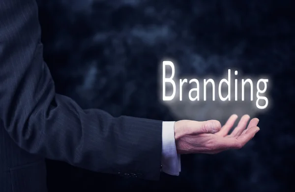 Empresário com inscrição Branding — Fotografia de Stock