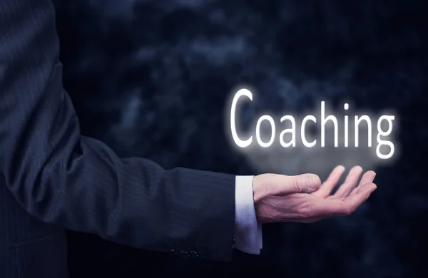 Empresario con inscripción de Coaching — Foto de Stock