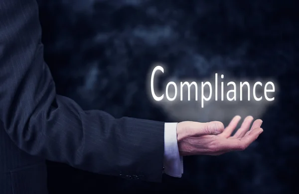 Zakenman met inscriptie van de Compliance — Stockfoto