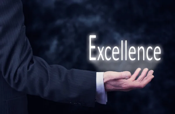 Zakenman met Excellence inscriptie — Stockfoto