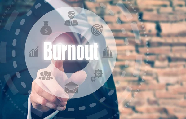 Empresário selecionando um botão Burnout — Fotografia de Stock