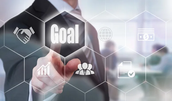 Businessman pressing an Goal button — Stock Photo, Image