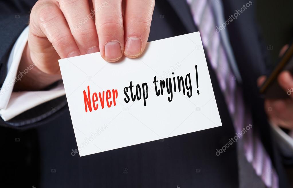 Never stop trying written on  business card