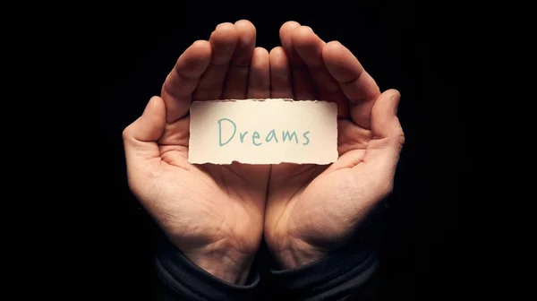Dreams on card in hands — Stock Photo, Image
