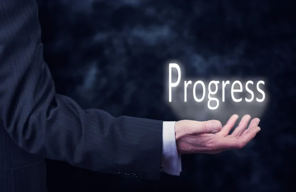 Рука за руку слово прогресс . — стоковое фото