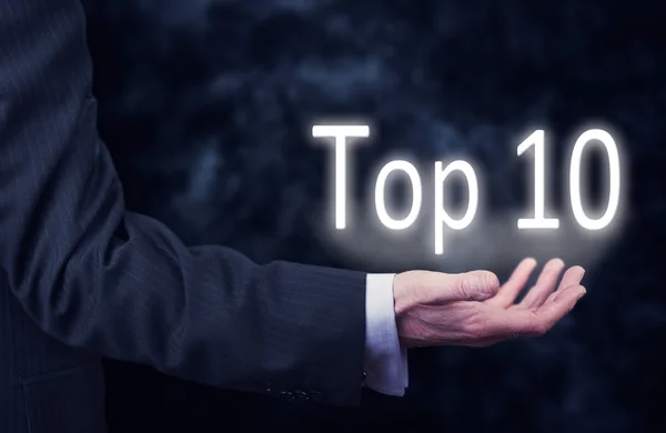 Hand mit den Worten Top 10. — Stockfoto