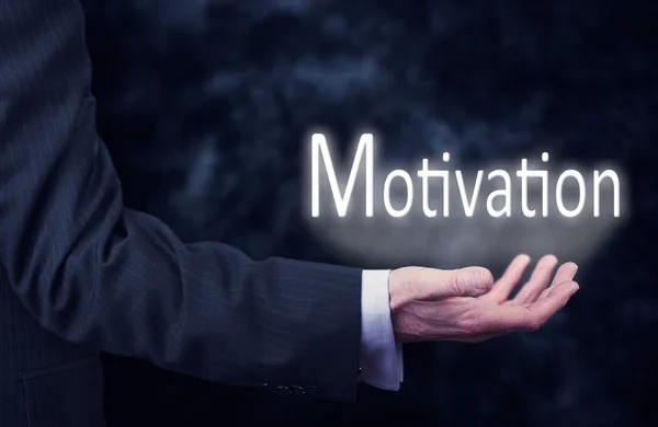 Ruka držící slovo motivace. — Stock fotografie