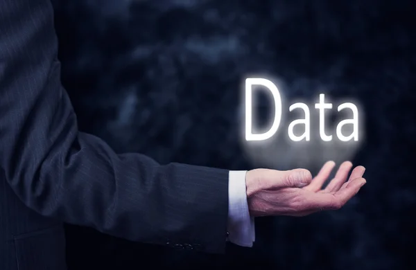 Hand som håller word Data. — Stockfoto