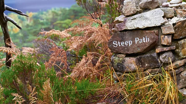 Mountain path marker embossed on stone — Stock Photo, Image