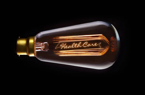 Good Healthcare Concept dans une ampoule à incandescence — Photo