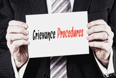 Black and red inscription Grievance Procedures clipart