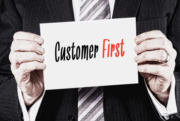 Black and red inscription Customer First — Stock Photo, Image