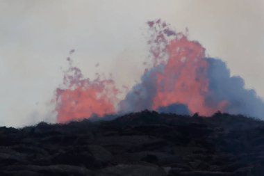 Aerial view of the eruption of the volcano Kilauea on Hawaii, in the picture Fissure7 you can see the enormous heat in the air. clipart