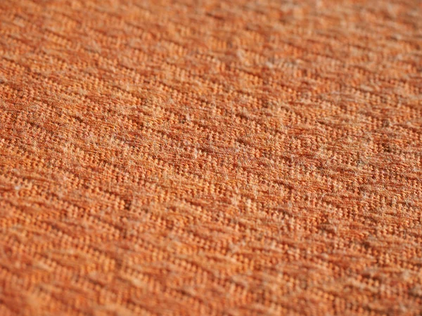 Oranje stof achtergrond — Stockfoto