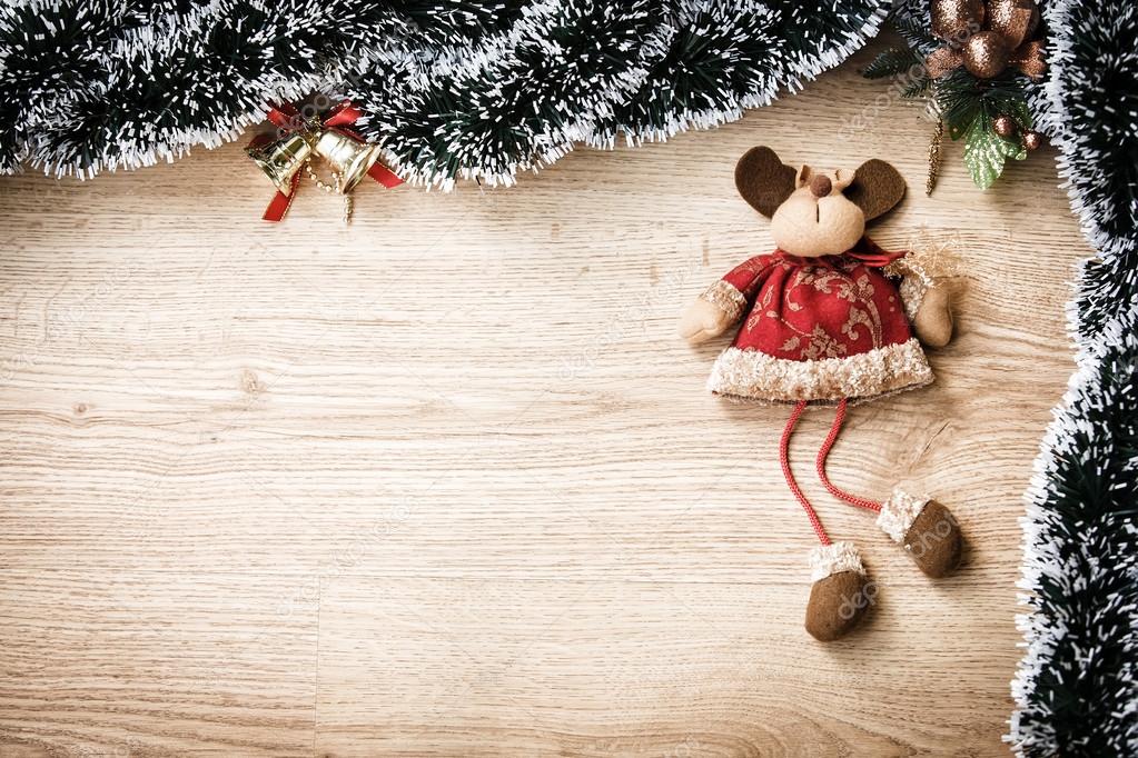 Plush christmas reindeer on wooden background