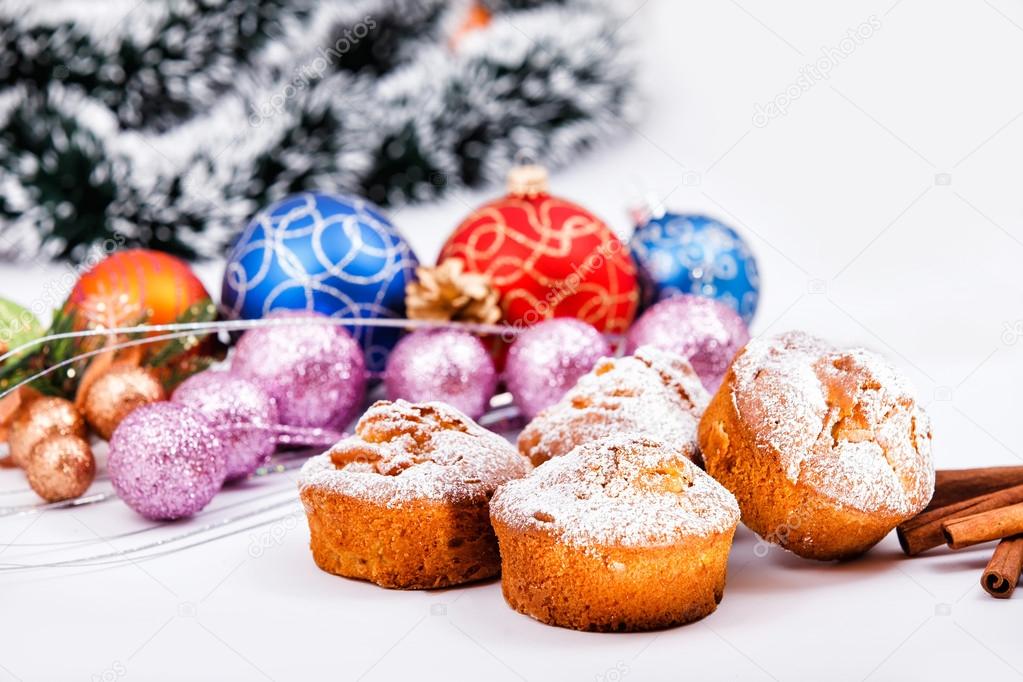 Muffins, christmas decorations in background.