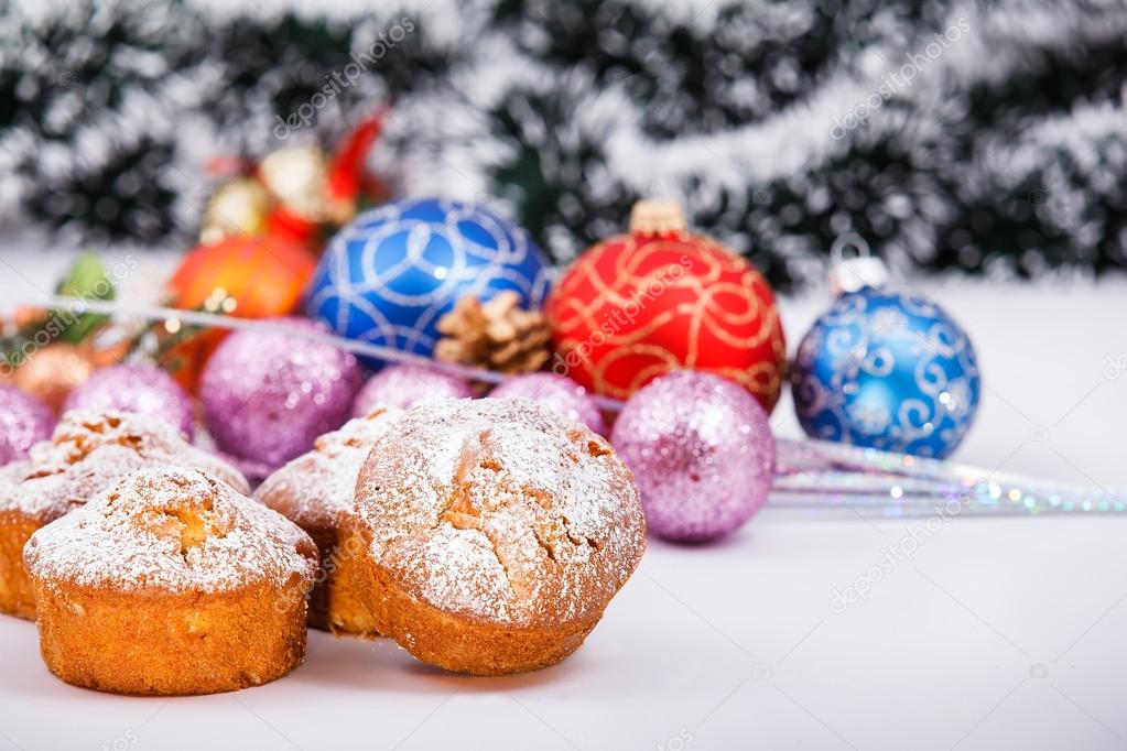 Muffins, christmas decorations in background.
