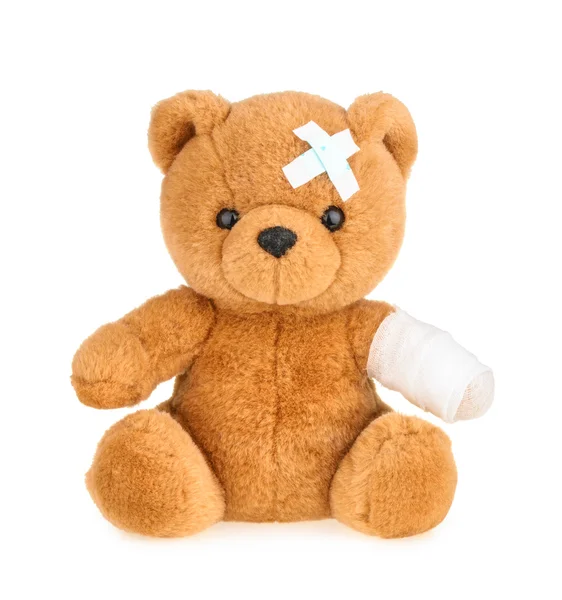 Oyuncak ayı beyaz izole bandaj ile