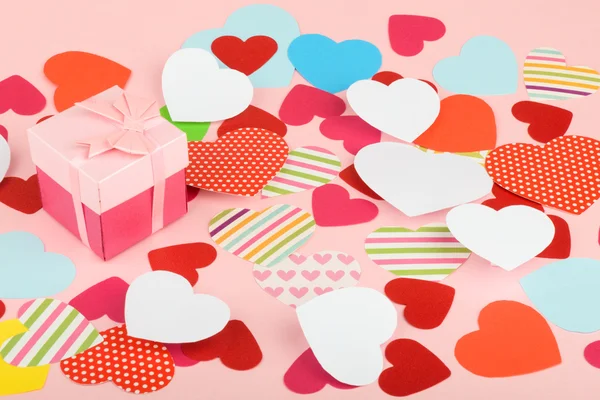 Paper hearts on red background — Stock Photo, Image