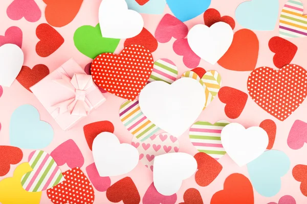 Paper hearts on pink background — Stock Photo, Image