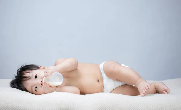 Cute Baby Holding Feeding Bottle — Stock Photo, Image