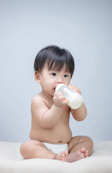 Cute Baby Holding Feeding Bottle — Stock Photo, Image
