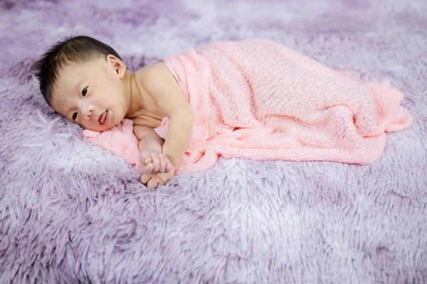 Newborn Cute Baby Infant on wool shag rug background