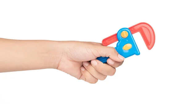 Mână Ținând Cheie Jucărie Din Plastic Izolată Fundal Alb — Fotografie, imagine de stoc