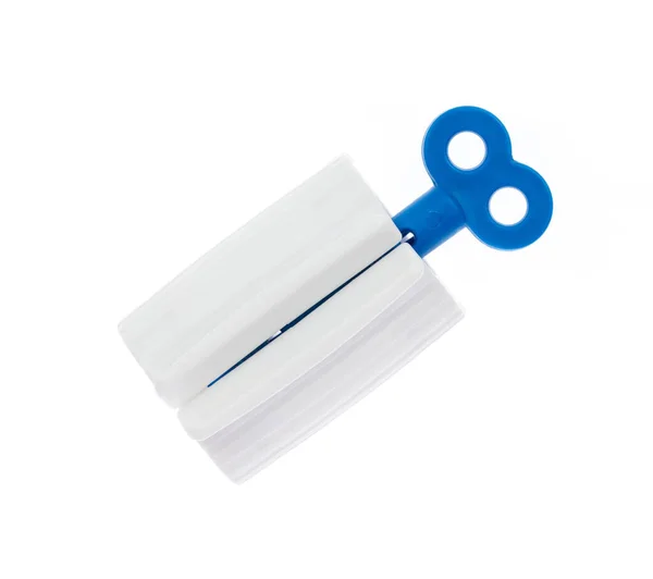 白い背景に隔離された歯磨き粉スクイーザー — ストック写真