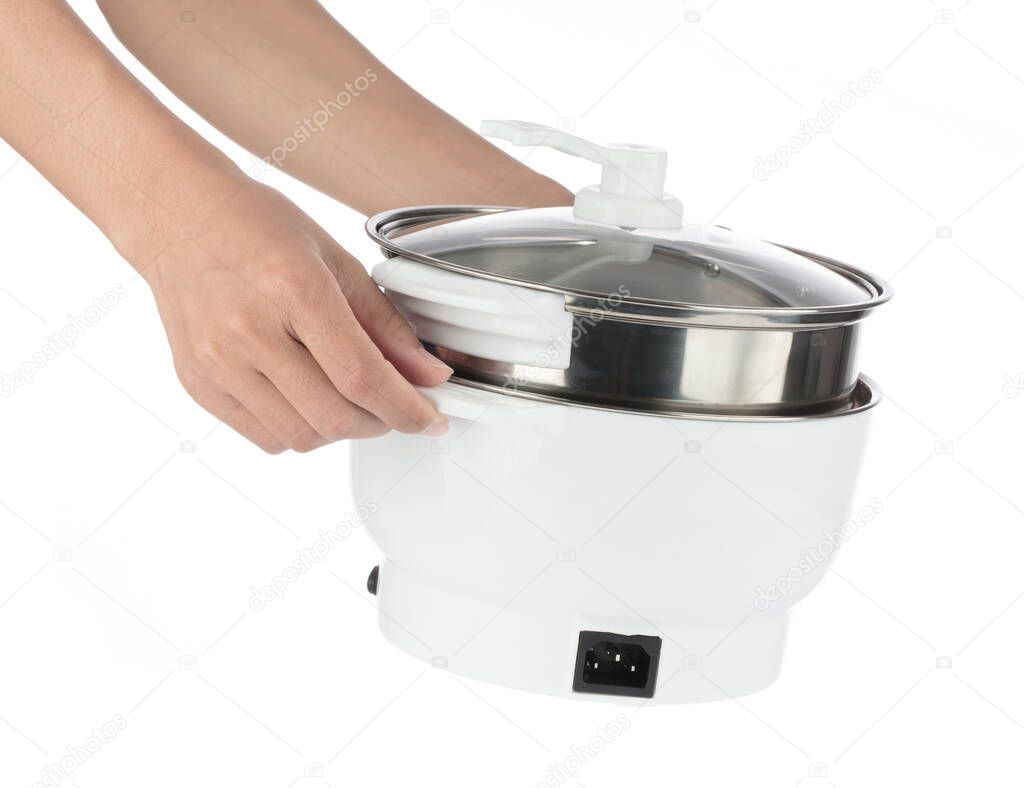 hand holding Electric Slow Cooker isolated on white background.