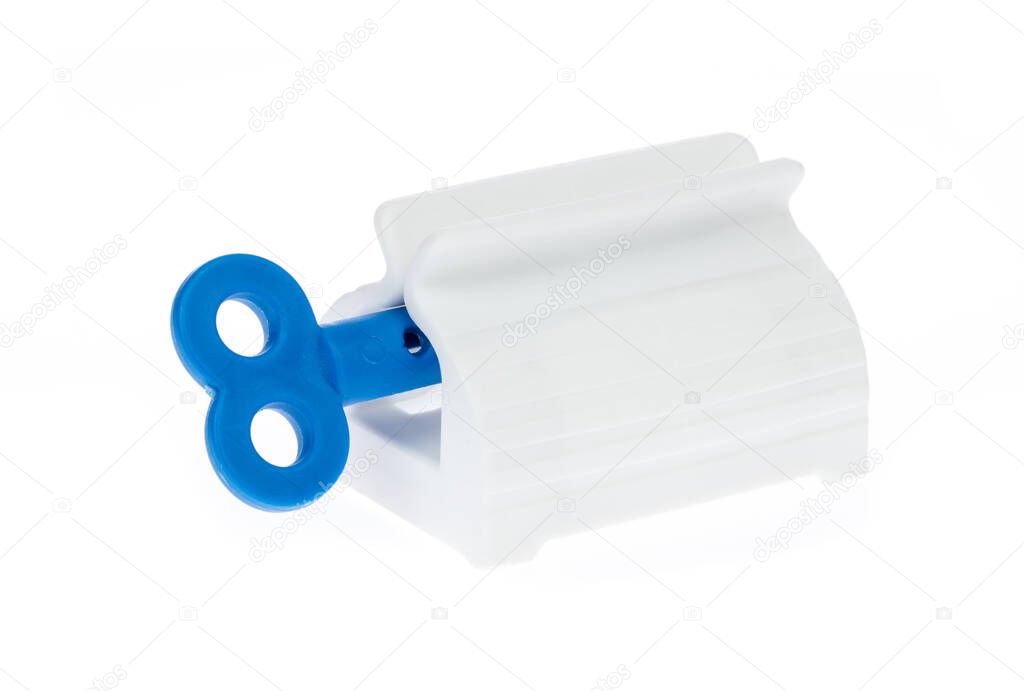 Toothpaste squeezer isolated on white background.