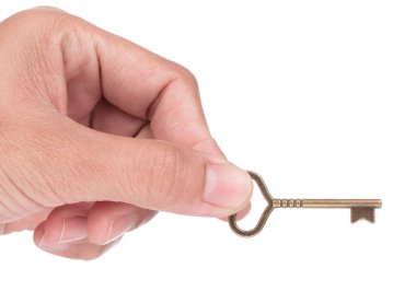 Beyaz arkaplanda küçük şirin bir anahtar var.