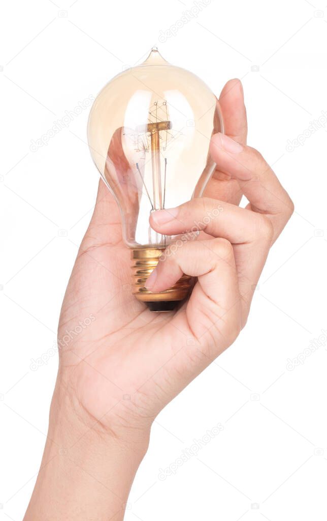 Hand holding Vintage bulb lamp isolated on a white background