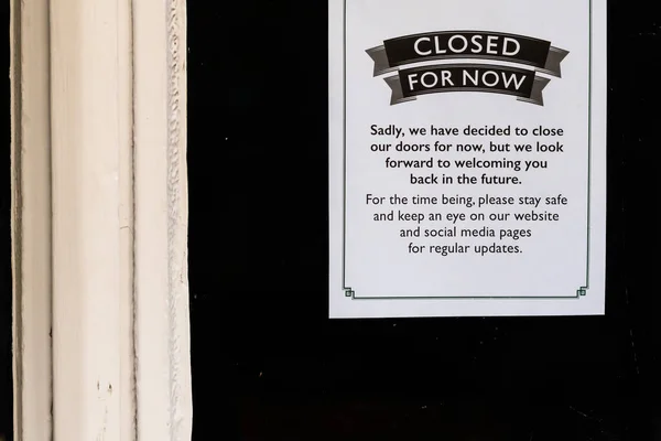 Closed for now sign on a restaurant window during covid-19 pandemic