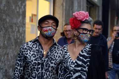 Guests and models at the Dolce & Gabbana show during Milan Fashion Week clipart