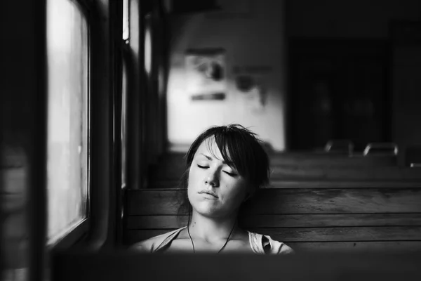 Girl sleeping in train — Stock Photo, Image